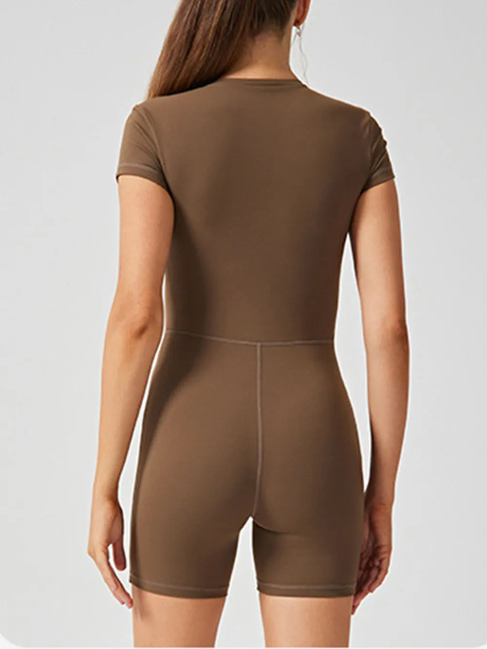 Barevici Shift half zip active romper women’s short sleeve sculpting one piece in brown, back view