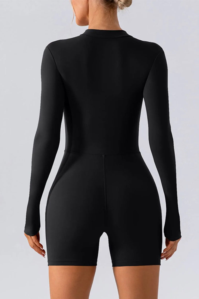 Barevici Vantage half zip active romper women’s long sleeve sculpting one piece in black, back view