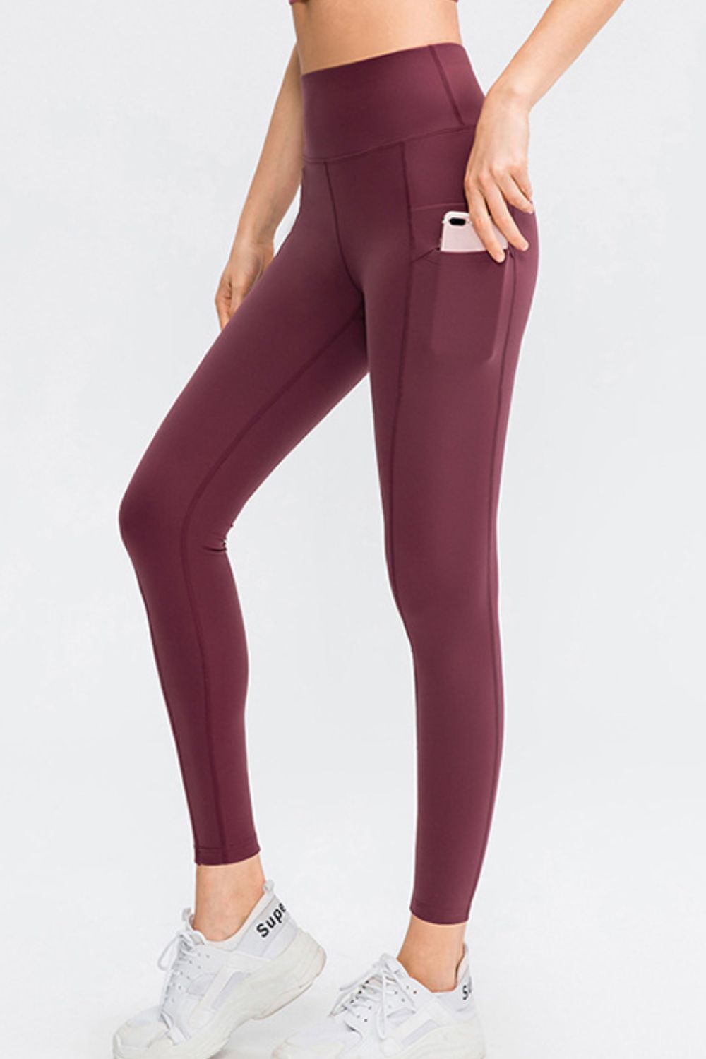 Barevici Relay pocket pants women’s wide waistband slim fit long sports tights with pockets in burgandy.