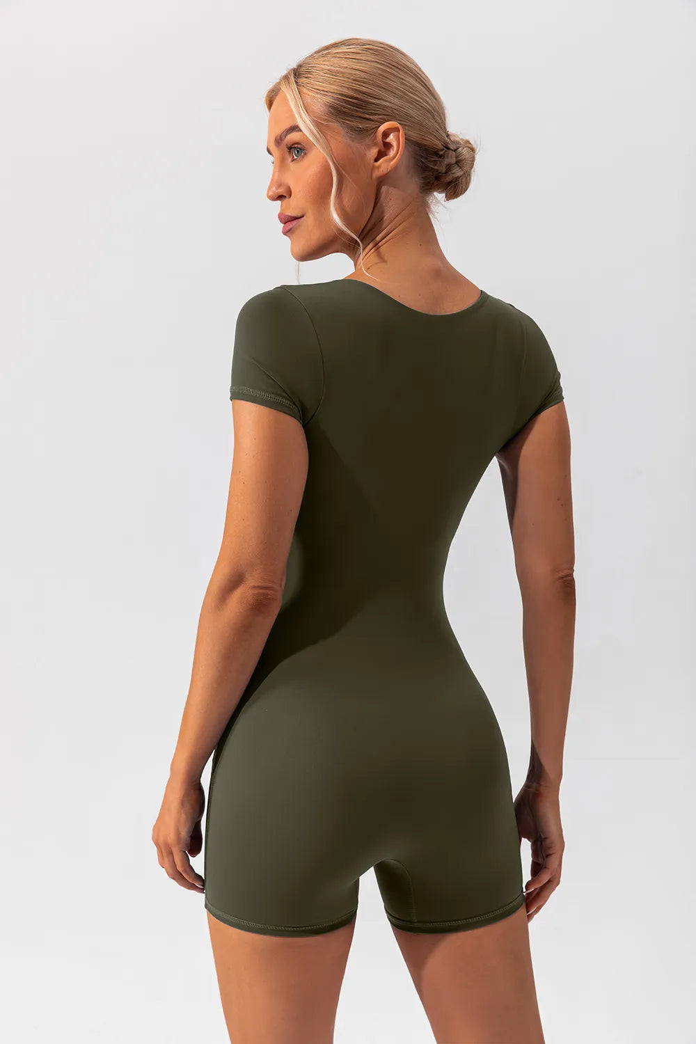 Barevici Poise cap sleeve active romper women’s square neck sculpting one piece in matcha green, back view