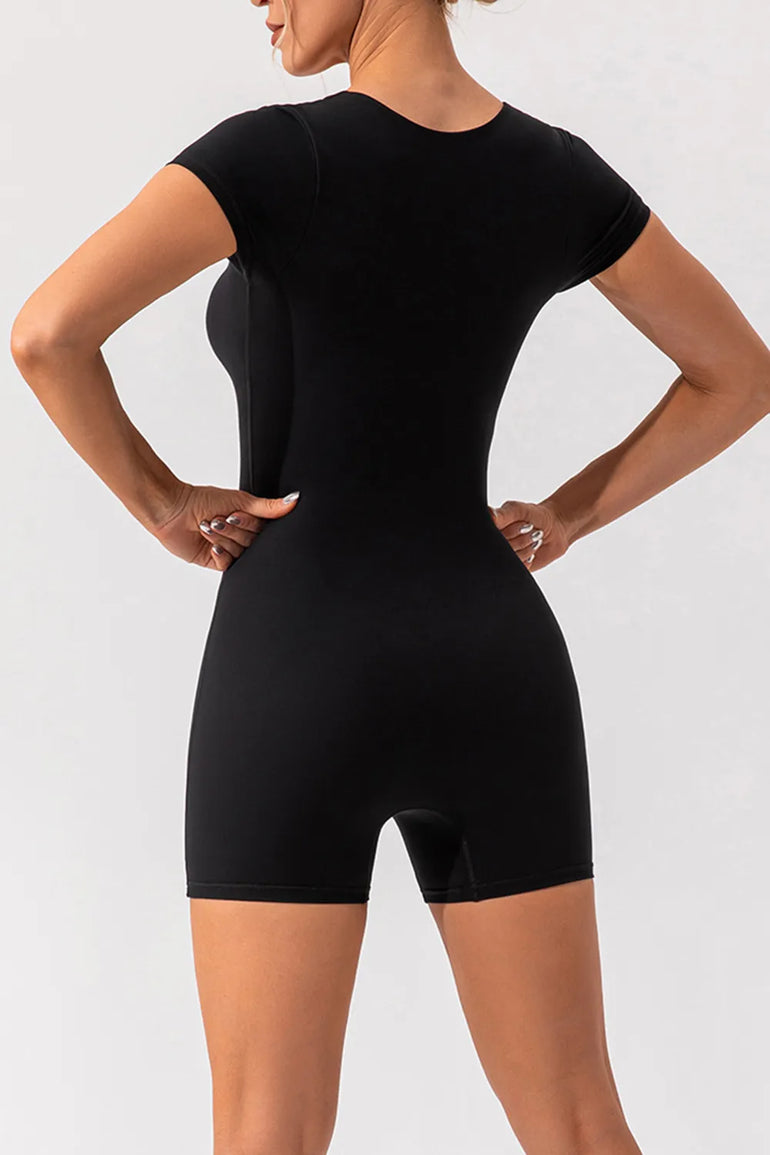 Barevici Poise cap sleeve active romper women’s square neck sculpting one piece in black, back view