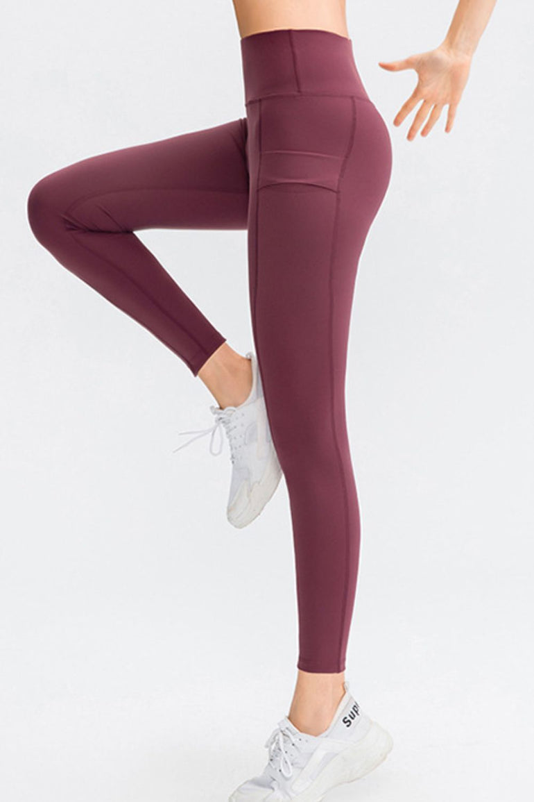 Barevici Relay pocket pants women’s wide waistband slim fit long sports tights with pockets in burgandy.