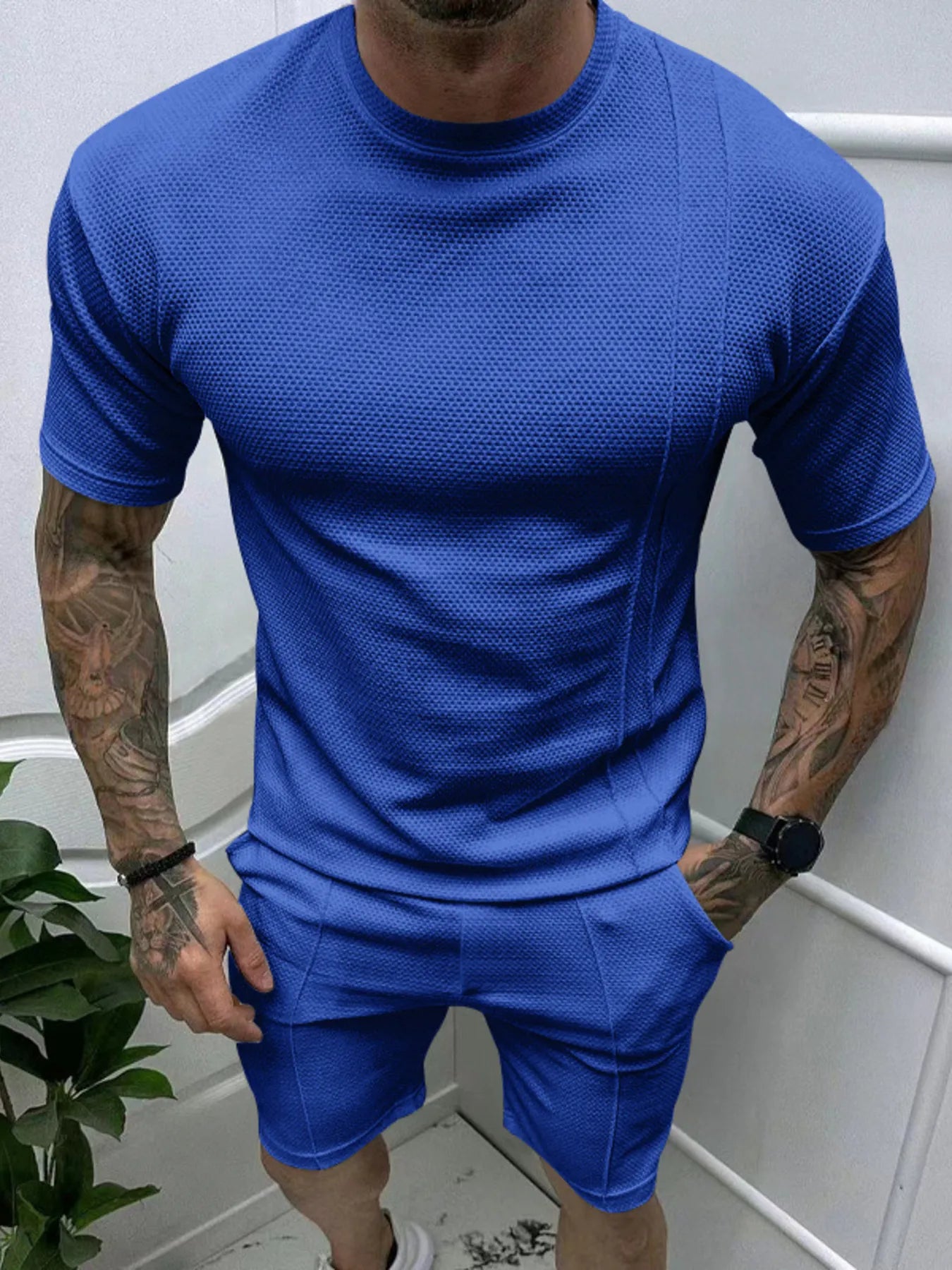  man wearing Barevici Haven Set tee and shorts set, shirt front view Sapphire Blue