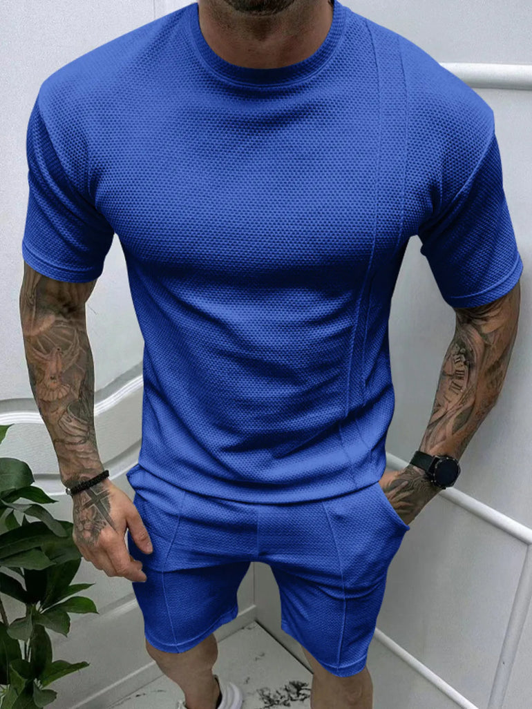  man wearing Barevici Haven Set tee and shorts set, shirt front view Sapphire Blue