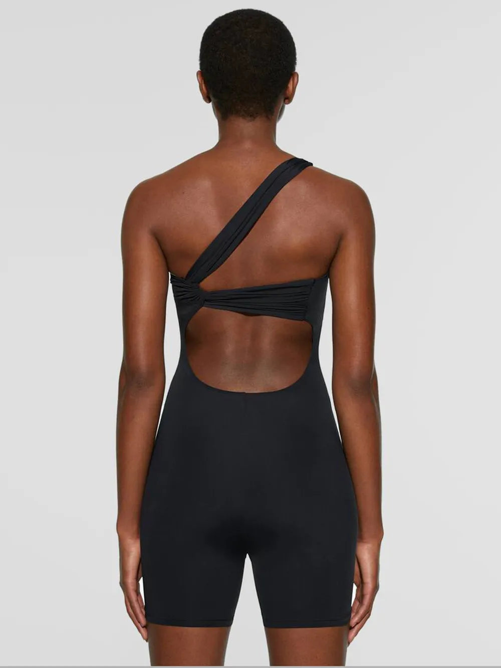 Barevici Solo one shoulder active romper women’s minimalist sculpting one piece in black back view